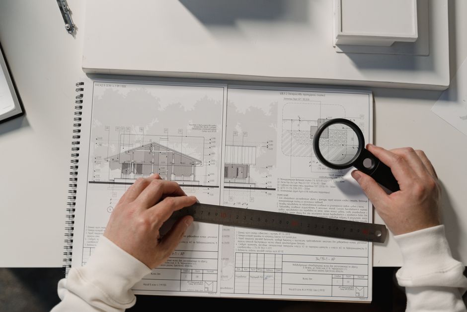 An architect meticulously drawing detailed blueprints at a clean, well-lit desk, symbolizing the precision of an 'engineered' content model.