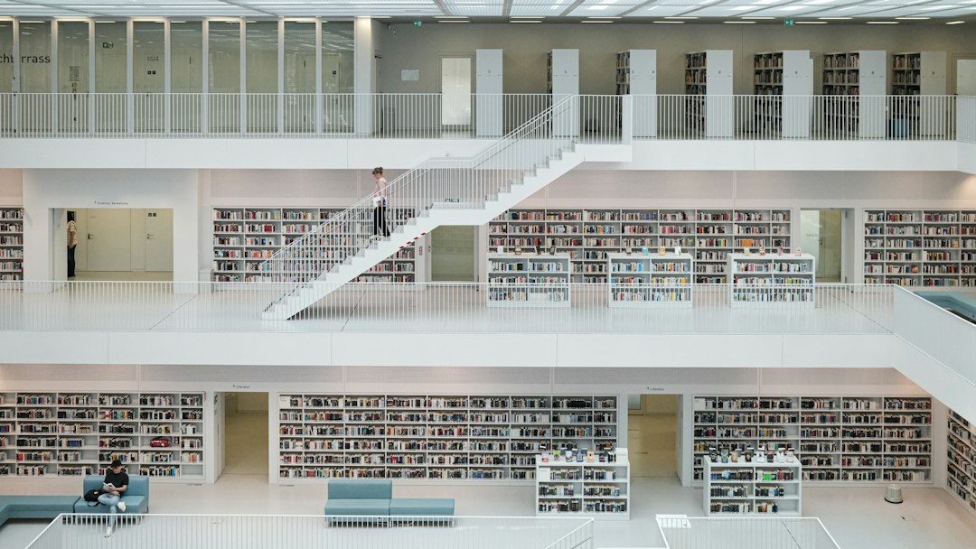 A bright, modern library aisle with perfectly organized bookshelves stretching into the distance, illustrating the concept of easily retrievable information.